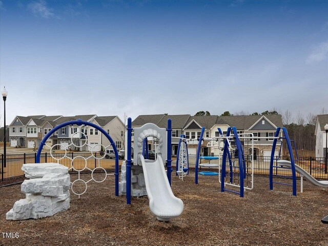 1024 Channel Drop, Zebulon, NC 27597 - communal playground with fence and a residential view
