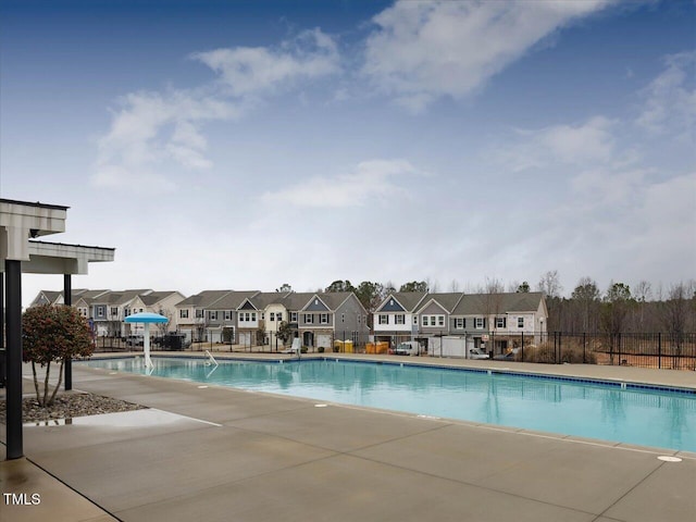 1024 Channel Drop, Zebulon, NC 27597 - community pool with fence, a residential view, and a patio area