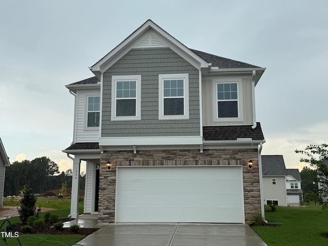 1024 Channel Drop, Zebulon, NC 27597 - craftsman-style house featuring stone siding, concrete driveway, a garage, and a front yard