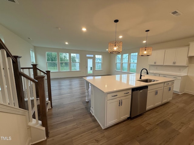 1024 Channel Drop, Zebulon, NC 27597 - kitchen with stainless steel dishwasher, a center island with sink, recessed lighting, white cabinetry, and dark wood-style floors