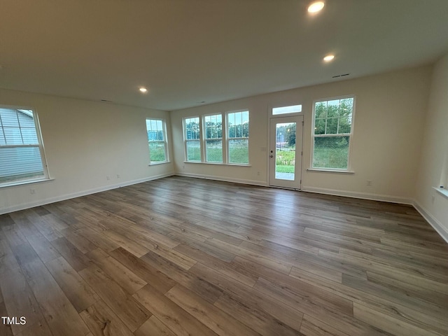 1024 Channel Drop, Zebulon, NC 27597 - spare room with plenty of natural light, dark wood-style floors, and recessed lighting