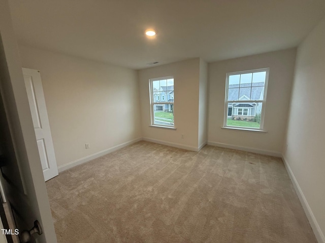 1024 Channel Drop, Zebulon, NC 27597 - spare room with light carpet and recessed lighting