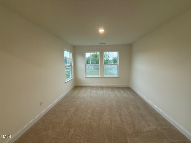 1024 Channel Drop, Zebulon, NC 27597 - unfurnished room with light colored carpet and recessed lighting
