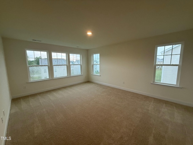1024 Channel Drop, Zebulon, NC 27597 - spare room with light carpet and recessed lighting