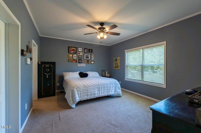 bedroom with carpet floors, baseboards, crown molding, and a ceiling fan