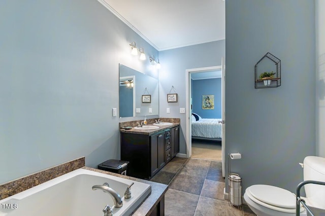 bathroom with toilet, a bath, crown molding, vanity, and ensuite bath