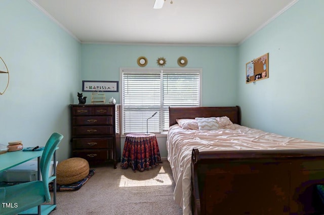 carpeted bedroom featuring crown molding and a ceiling fan