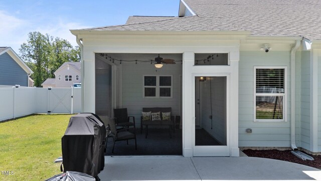 view of patio with a gate and ceiling fan