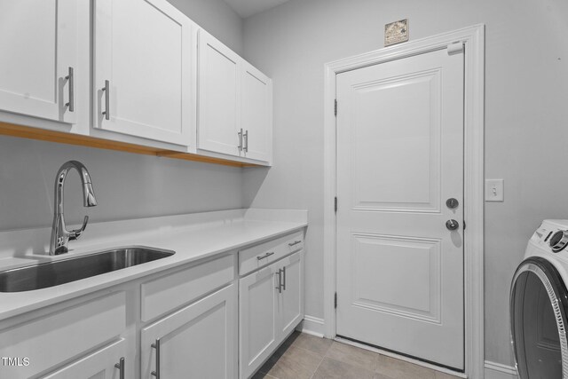 laundry area featuring washer / clothes dryer and cabinet space