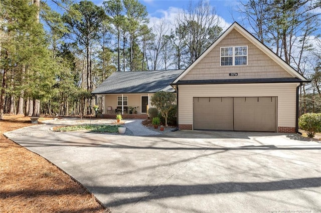 view of front of home featuring a garage and driveway