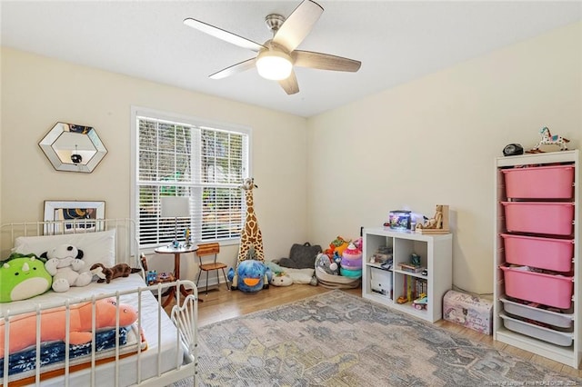 bedroom featuring a ceiling fan and wood finished floors