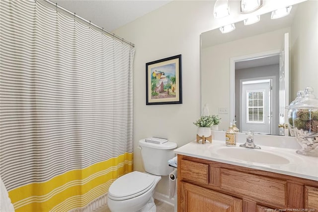 bathroom with vanity and toilet