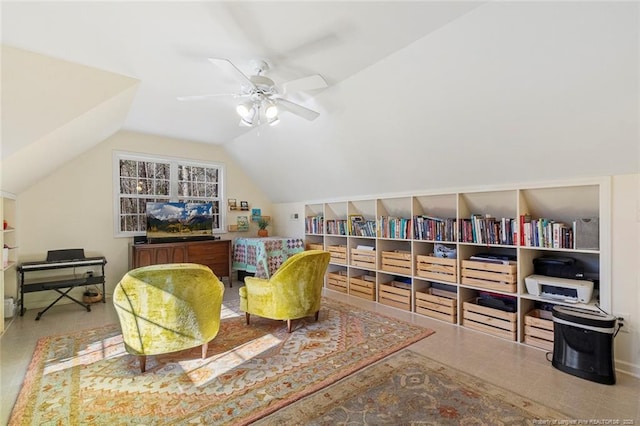 sitting room featuring ceiling fan and lofted ceiling