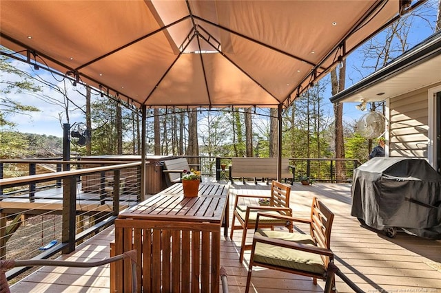 wooden deck featuring grilling area