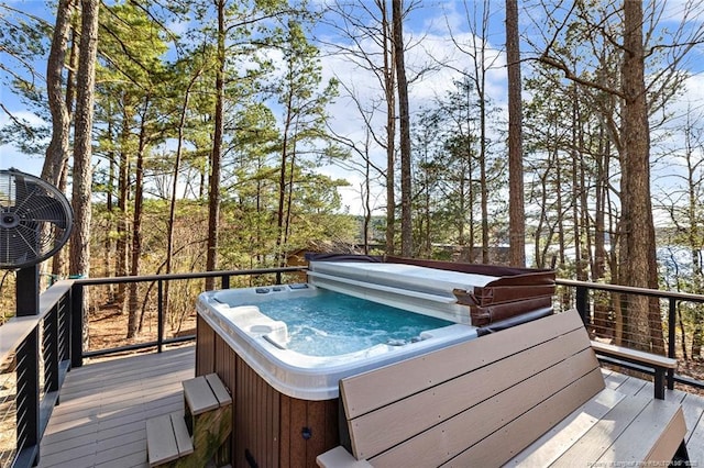 wooden deck featuring a hot tub