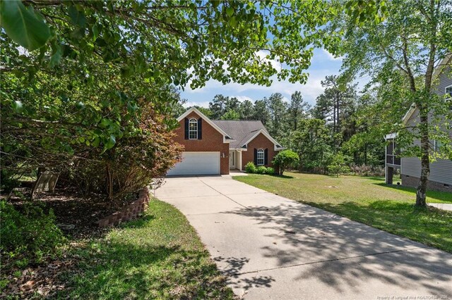 481 Clearwater Harbour, Sanford, NC 27332 - view of front facade featuring concrete driveway, a front lawn, and brick siding
