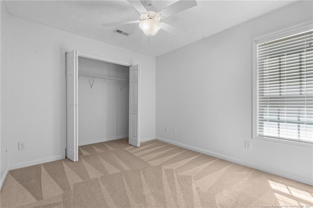 481 Clearwater Harbour, Sanford, NC 27332 - unfurnished bedroom featuring light colored carpet, a closet, baseboards, and a ceiling fan