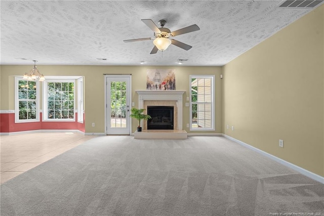 481 Clearwater Harbour, Sanford, NC 27332 - unfurnished living room with healthy amount of natural light, a chandelier, a tile fireplace, baseboards, and a textured ceiling