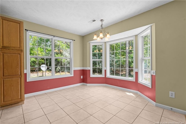 481 Clearwater Harbour, Sanford, NC 27332 - unfurnished dining area with a chandelier, baseboards, light tile patterned floors, and a textured ceiling
