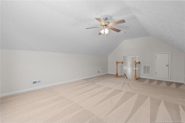481 Clearwater Harbour, Sanford, NC 27332 - additional living space featuring light colored carpet, baseboards, vaulted ceiling, a ceiling fan, and a textured ceiling