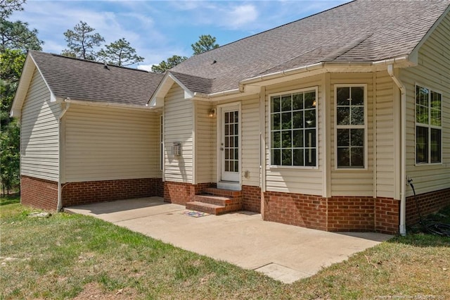 481 Clearwater Harbour, Sanford, NC 27332 - rear view of house with entry steps, a patio area, a shingled roof, and a yard