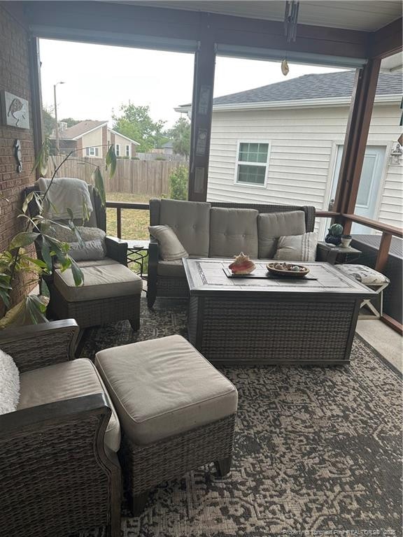 exterior space featuring outdoor lounge area and a healthy amount of sunlight