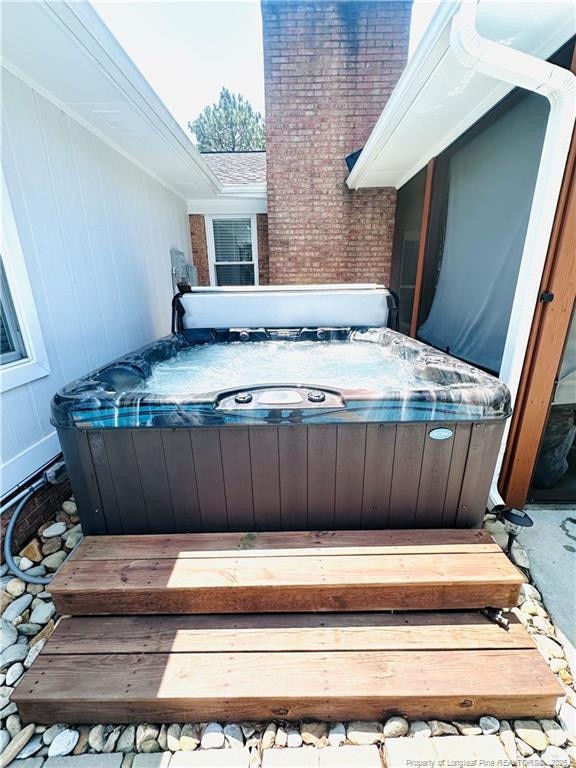 5706 Archer Rd, Hope Mills, NC 28348 - wooden terrace featuring a hot tub