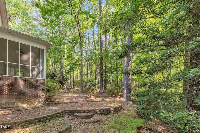 view of yard with a sunroom