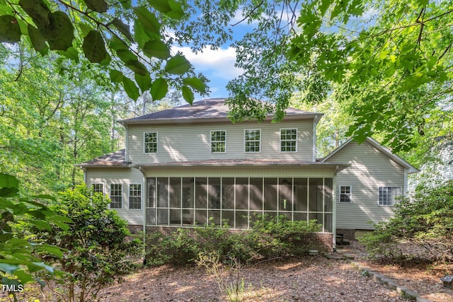 back of house with a sunroom