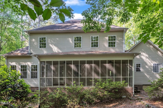 rear view of house with a sunroom