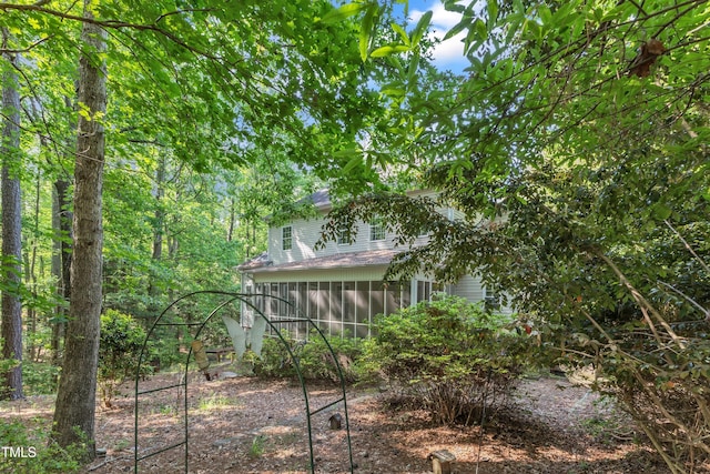 view of yard featuring a sunroom
