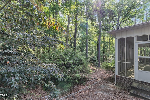 view of yard with a sunroom