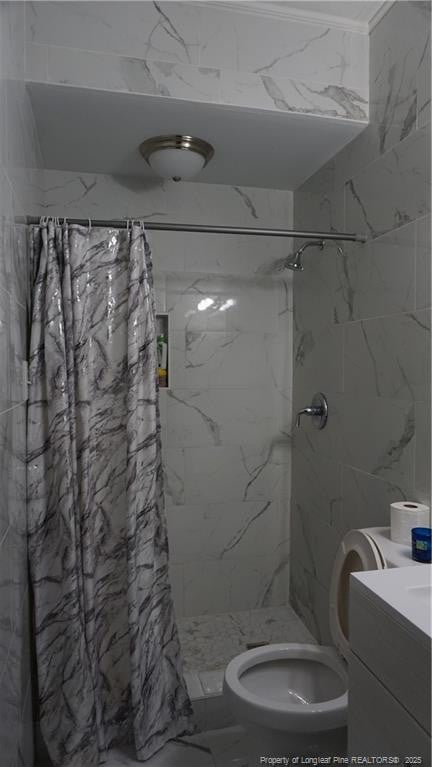 bathroom featuring vanity, marble finish floor, a stall shower, and toilet
