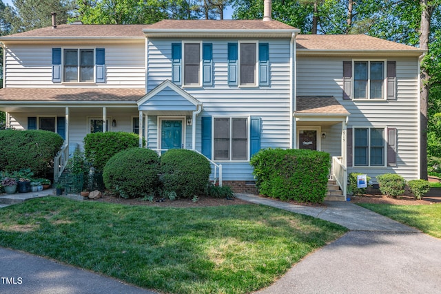 6513 Hearthstone Dr, Raleigh, NC 27615 - view of front facade with a front lawn and roof with shingles