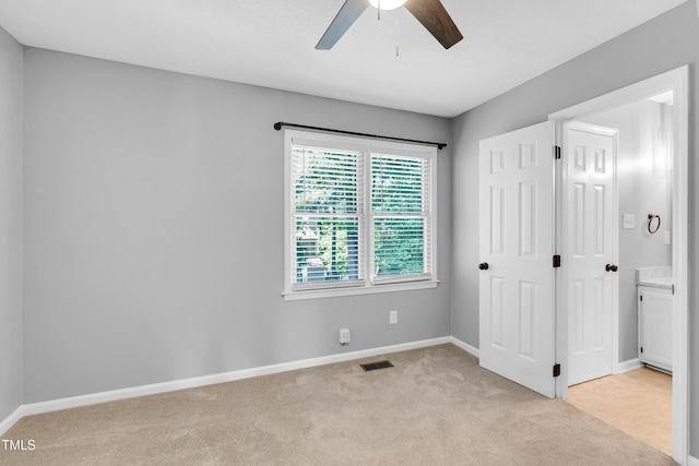 6513 Hearthstone Dr, Raleigh, NC 27615 - unfurnished bedroom with light carpet, baseboards, and a ceiling fan