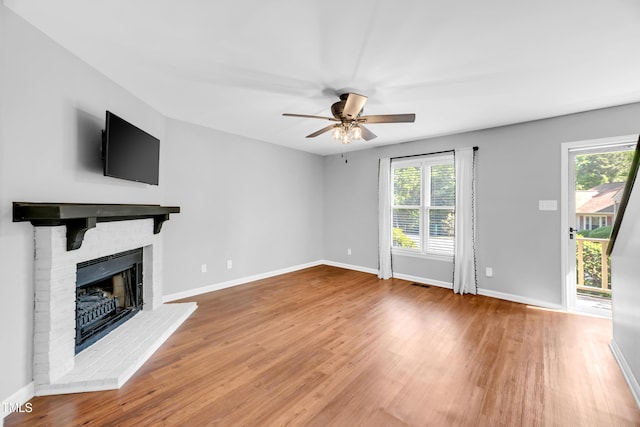 6513 Hearthstone Dr, Raleigh, NC 27615 - unfurnished living room with plenty of natural light, wood finished floors, and baseboards