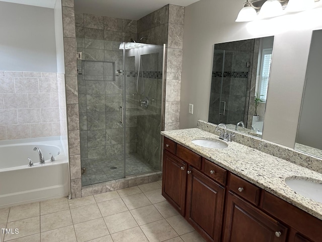full bathroom with a sink, tile patterned flooring, double vanity, a bath, and a stall shower