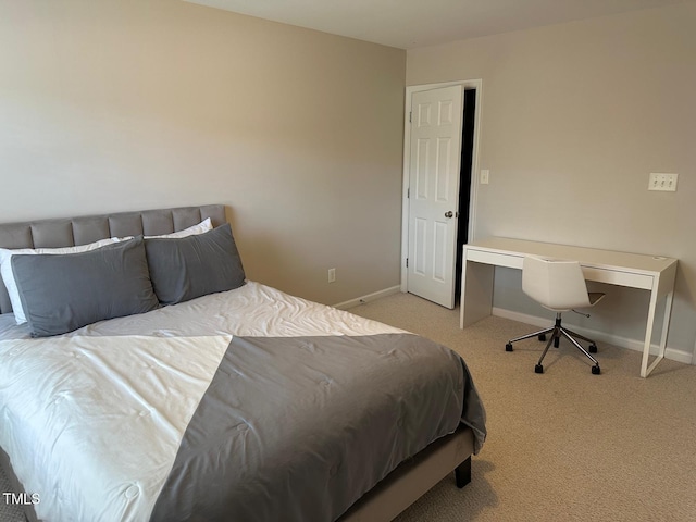 bedroom featuring carpet floors and baseboards