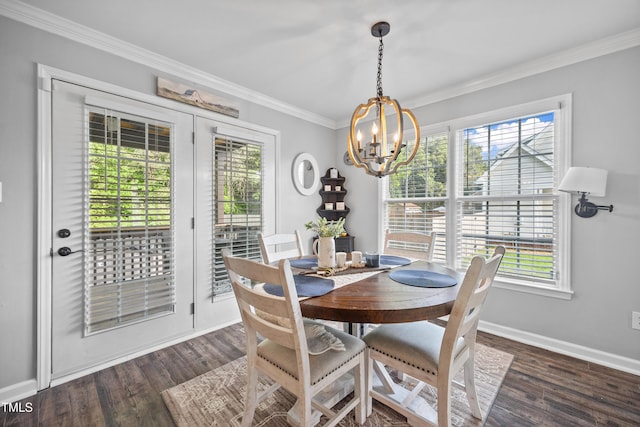 dining area with an inviting chandelier, ornamental molding, baseboards, and a healthy amount of sunlight