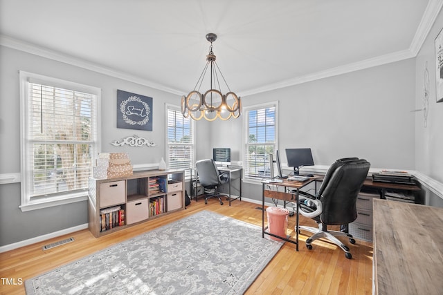 home office featuring crown molding, a notable chandelier, wood finished floors, and visible vents