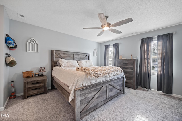 bedroom featuring baseboards, visible vents, light carpet, and ceiling fan