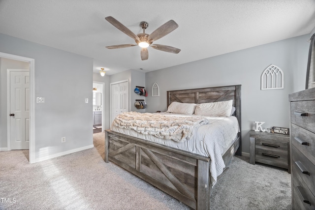 bedroom featuring carpet floors, baseboards, a closet, and ceiling fan