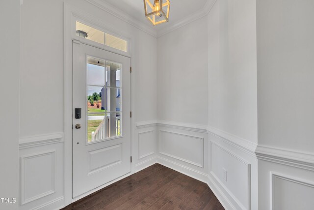 384 Grey Hawk Dr, Garner, NC 27529 - entryway with dark wood finished floors, a wainscoted wall, crown molding, and a chandelier