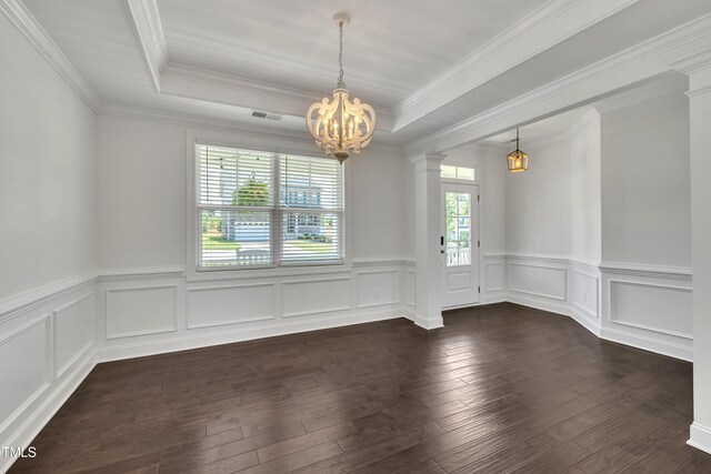 384 Grey Hawk Dr, Garner, NC 27529 - unfurnished dining area with a chandelier, a tray ceiling, a wainscoted wall, dark wood-style flooring, and crown molding