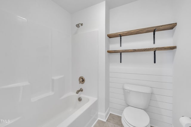 384 Grey Hawk Dr, Garner, NC 27529 - bathroom featuring toilet, baseboards, and bathing tub / shower combination