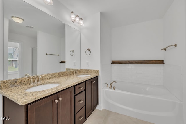384 Grey Hawk Dr, Garner, NC 27529 - full bath featuring a garden tub, tile patterned flooring, and double vanity