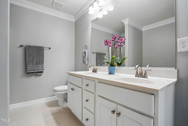 bathroom featuring baseboards, crown molding, visible vents, and a sink