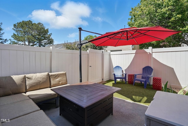 view of patio with an outdoor hangout area and a fenced backyard