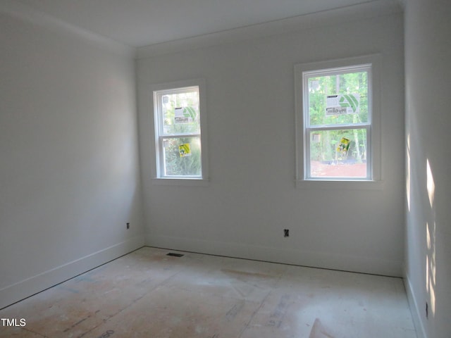 spare room featuring baseboards