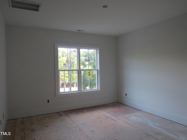 spare room with visible vents and baseboards
